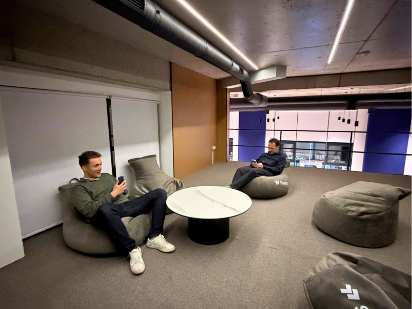 Daniel and Betim heads-down at a shared desk