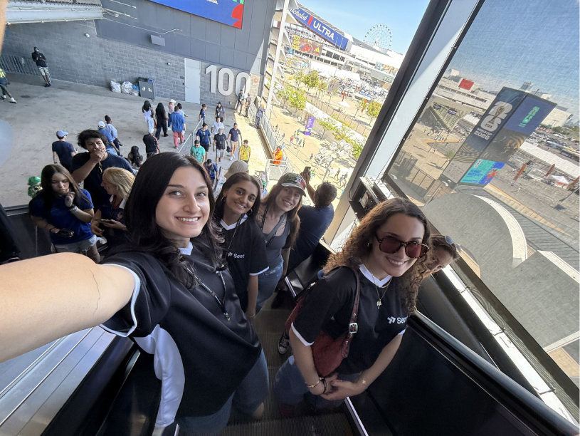 The team crowded into a selfie on a stadium concourse